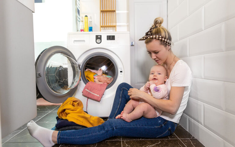 Overwhelmed mother with infant.